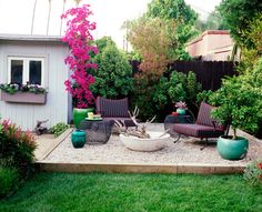 an outdoor patio with chairs and flowers in the background