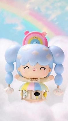 a small doll is sitting on top of a cloud with a rainbow in the background