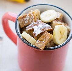 a red mug filled with french toast and bananas