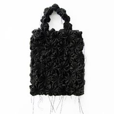 See-through bag with hancrafted flowers. Made from recycled fabric. Eco-friendly, durable and perfect for everyday use. About the product: - Color: Black- Size: One Size- Handcrafted and shipped from our workshop in Quebec- Composition: 34% Viscose, 33% Polyester,32% Wool, 1% Spandex- Care: Hand wash cold. Dry flat Dimension (without handles):-Height: 15 "-Width: 12 1/2 " Handmade Black Bags For Spring, Handmade Ceramics Vase, Abstract Flowers, Recycled Fabric, Handmade Flowers, Hand Washing, Handmade Ceramics, Cold Water, Handles