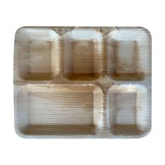 an empty plastic tray with four compartments