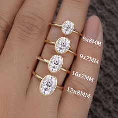 three different sizes of diamond rings on someone's hand with measurements for each ring