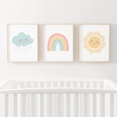 three framed pictures on the wall above a crib in a baby's room