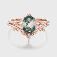 Unveil the beauty of nature's artistry with our Long Hexagon Moss Agate Ring Set, delicately crafted in 14K rose gold. Each ring in this set is a unique testament to the wonders of the natural world, showcasing the mesmerizing patterns and soothing hues of genuine moss agate. Luxury Adjustable Agate Rings, Luxury Gold Agate Rings, Luxury Agate Gemstone Rings, Moss Agate Ring, Agate Ring, Moss Agate, Natural World, Ring Set, Ring Sets