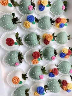 there are many decorated chocolates in the shape of flowers