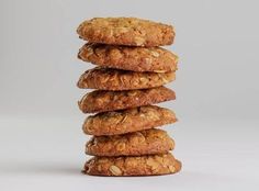 a stack of oatmeal cookies sitting on top of each other in front of a white background