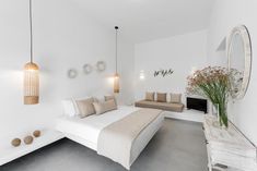 a bedroom with white walls and grey flooring