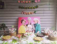 an old woman's birthday party with cake, cookies and candies