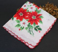 "For your consideration is a beautiful vintage handkerchief Christmas poinsettia red, white and a scalloped edge. It is in good condition with no holes, no stains and no pulls. It measures 11\" x 11\"  and is made out of cotton. If you have any questions, please convo me. Check out some other hankerchiefs listed at Treasure Cove Ally http://www.etsy.com/shop/treasurecoveally/search?search_query=hankies&search_type=user_shop_ttt_id_6215422&shopname=treasurecoveally I typically ship within 3-5 days of purchase, however, if you need your item shipped asap, please contact me and I will do my best to accommodate. Shipping: Item is being shipped from Canada. Shipping price quoted is for Surface which is the cheapest rate and take 10 to 15 business days. Should you require faster service such as Vintage Handkerchief, Christmas Poinsettia, Vintage Handkerchiefs, Cotton Gifts, Scalloped Edge, Poinsettia, Making Out, Etsy Gifts, Scarf Accessory