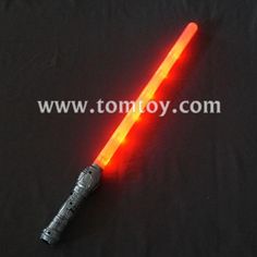 an orange light saber on a black background