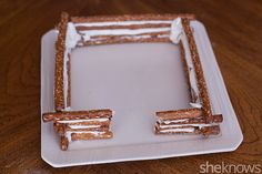 a white plate topped with pretzels on top of a wooden table