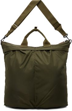 Lightweight nylon canvas tote in khaki. · Press-stud tab at webbing carry handles · Adjustable and detachable crossbody strap · Logo patch at face · Patch pockets and pleats · Zip closure · Zip pocket at interior · Fully lined · H16.5 x W18 x D2 Supplier color: Olive drab Military Style Nylon Bags For Everyday Use, Military Travel Bag With Pockets, Khaki Nylon Bags With Zipper Closure, Khaki Nylon Bag With Zipper Closure, Khaki Nylon Tote Bag, Military Style Shoulder Bag For Travel, Military Style Travel Bag With Adjustable Strap, Military Style Travel Bag With Multiple Pockets, Military Travel Bags With Adjustable Strap