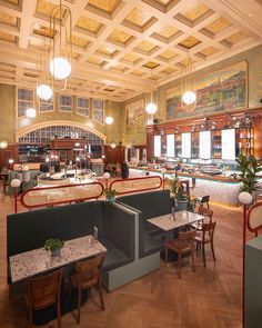 the inside of a restaurant with tables and chairs