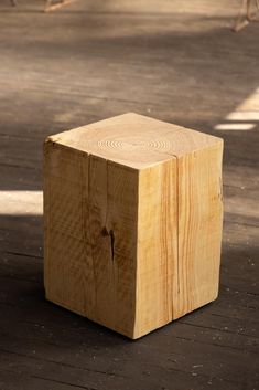 a wooden block sitting on top of a floor