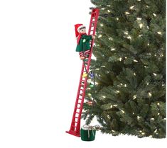 the elf is climbing the ladder to decorate the christmas tree