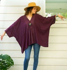 Embrace effortless boho style with our Raw Natural Cotton Gauze Blouse. This oversized cotton summer top combines minimalist design with comfort, making it an essential piece for your wardrobe. Handmade with care, this tunic is perfect for casual events, lounging, or summer days. Key Features * Boho Minimalist Design: Featuring a chic, oversized style with a stylish V-neck and asymmetrical hemline. * Premium Material: Made from raw natural crinkled cotton gauze, offering a soft and breathable feel. * Handmade: Each blouse is handmade, ensuring unique craftsmanship and attention to detail. * Eco-Friendly Shipping: Ships from Texas, reducing the carbon footprint and ensuring faster delivery times. * Woven Accents: Woven front and back accents add texture and a unique touch to the blouse. Siz Casual Cotton Poncho With Relaxed Fit, Fall Vacation Tunic With Relaxed Fit, Bohemian V-neck Blouse With Relaxed Fit, Bohemian Relaxed Fit V-neck Blouse, Bohemian V-neck Relaxed Fit Blouse, Cotton Batwing Sleeve Blouse Relaxed Fit, Relaxed Fit Cotton Blouse With Batwing Sleeves, Cotton Batwing Sleeve Relaxed Fit Blouse, Oversized Cotton Tunic For Summer