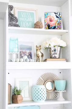 some shelves with pictures and vases on them