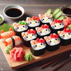 there are many sushi rolls with hello kitty on them and some cucumbers