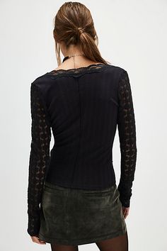 Effortlessly femme, this long-sleeve top features sheer lace detailing and a deep V-neckline with contrast sleeves and exposed seams. **Fit:** Slim, relaxed fit **Features:** Soft fabrication with sheer lace trim, deep V-neckline with scalloped trim, contrast sleeve detail, exposed seams throughout **Why We ❤ It:** This lace-adorned top can be dressed up or down for any occasion. | This Could Be Us Long-Sleeve Top by Free People in Black, Size: S Black Long Sleeve Lace Top For Layering, Fall Lace Top With Sheer Long Sleeves, Chic Long Sleeve Lace Top For Layering, Fall Lace Patchwork V-neck Top, Fall V-neck Lace Patchwork Top, Fitted Long Sleeve Lace Top For Fall, Long Sleeve Lace Patchwork Tops For Layering, Long Sleeve Tops With Lace Patchwork For Layering, Fall V-neck Top With Sheer Sleeves