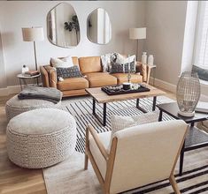 a living room filled with furniture and mirrors