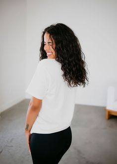 Short Sleeve crew neck graphic tee, loose in all the right places. Featuring an open neckline with slightly dropped sleeves. Made in our soft 100% cotton fabrication. Serenity is wearing a size small. Measurements: Body Length: 30" | Sleeve Length: 9" Small: Bust: 38" Arm: 16" Medium: Bust: 39" Arm: 17" Large: Bust: 43" Arm: 17.5" XL: Bust: 48" Arm: 18" 100% Cotton Effortless Short Sleeve T-shirt For Loungewear, White Relaxed Short Sleeve T-shirt, Relaxed Soft-washed White Top, White Relaxed Soft-washed Tops, Relaxed White Soft-washed Top, Organic Cotton Crew Neck T-shirt For Loungewear, Relaxed White Tops With Graphic Print, White Relaxed Tops With Graphic Print, Relaxed White Top With Graphic Print