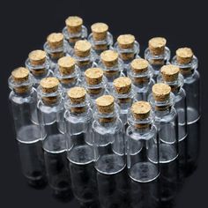 many small bottles with corks are shown in front of a black background and the price is $ 4 00