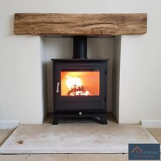 a wood burning stove sitting inside of a room