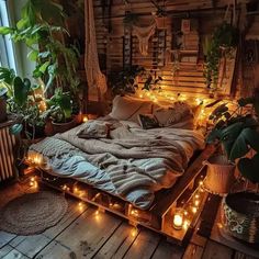 a bed with lots of plants and lights on it