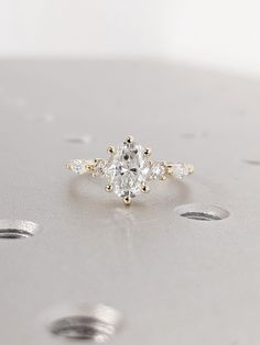 an engagement ring with three diamonds on it