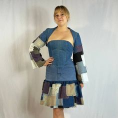 "3 Piece Denim Set 3 Piece Denim Set that includes a shrug, corset, and skirt!! Made by upcycling denim scraps. The shrug is designed with ruffles at the back and overlapped patchwork on the sleeves. Does not have a closure. The corset can be reversed and is adjustable. Has grommets at the back. The skirt has a button closure on the waistband and has a fly front zipper. Has a ruffle of patchwork on the hem of the skirt. Includes two pockets on either side of the skirt. Can fit up to a medium.  M Fitted Denim Blue Patchwork Dress, Fitted Patchwork Denim Dress, White Faux Fur Coat, Corset And Skirt, Denim Scraps, Denim Set, Blue Jean Outfits, Denim Suit, Upcycle Jeans