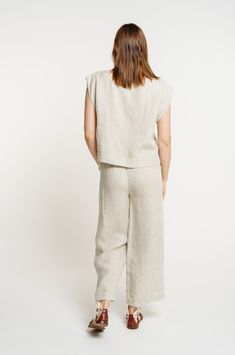 Our iconic Everyday Top is handcrafted from luxurious certified organic linen in new, Natural linen. This easy, minimalist top features a wide neckline, slightly boxy body, and mid-to-cropped length, perfect for tucking into our Everyday Crop Pant or wearing with your favorite jeans. We appreciate the natural beauty of linen's undyed color and are excited to highlight it this season in our new Natural colorway. Made with Organic Linen Lined with Organic Cotton Handmade in India Machine wash cold Versatile Cropped Linen Tops, Cropped Linen Workwear Tops, Cropped Linen Workwear Bottoms, Everyday Neutral Linen Top, Everyday Cropped Linen Top, Casual Cropped Linen Top, Relaxed Linen Tops For Casual Gatherings, Versatile Linen Tops For Loungewear, Relaxed Fit Linen Cropped Bottoms