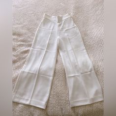 Not Full Length. Never Worn. Had These For A While And Now They’re Too Small. Beautiful And Flattering. Will Be Tight On The Waist And Loose Through Hips And Legs White Ankle-length Summer Pants, White Summer Ankle-length Pants, Summer Stretch White Pants, White Stretch Ankle-length Wide Leg Pants, Elegant Stretch White Pants, Elegant White Stretch Pants, White Stretch Wide Leg Pants With Pockets, White High-waisted Wide Leg Pants With Pockets, Fitted White Bottoms With Pockets