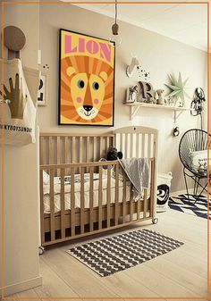 a baby's room is decorated in white and black