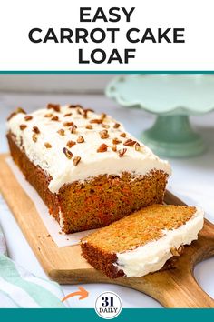 carrot cake loaf with cream cheese frosting on a cutting board