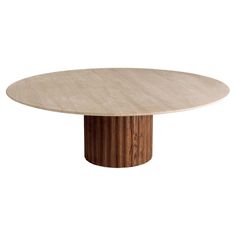 an oval dining table with a wooden base