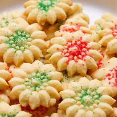 some cookies with sprinkles on a white plate