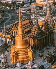 an aerial view of the city with many buildings and gold spires on each side