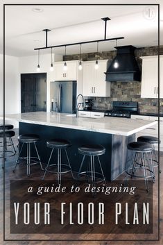 a kitchen with an island and bar stools in the center, surrounded by white cabinets