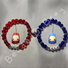 two beaded bracelets with cartoon characters on them, one is red and the other is blue