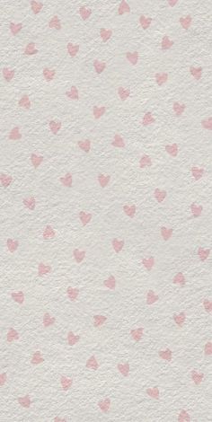 pink hearts on white paper with watercolor effect in the middle and light pink dots at the bottom