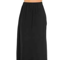 Standout Style Is Easy To Achieve With This Sashaying Skirt. Its Fold-Over Waist With Pockets On The Side That Make A Comfortable Fit, While Lightweight Fabric Falls To An Airy, Ankle-Kissing Hem. All Sizes Available 95% Rayon, 5% Spandex Hand Wash, Hang Dry Made In Usa Casual Full-length Black Skirt, Casual Black Full-length Skirt, Black Stretch Maxi Skirt With Elastic Waistband, Versatile Black Midi Skirt, Versatile Black Long Skirt, Black Versatile Midi Skirt, Black Midi Skirt Versatile Bottoms, Versatile Black Stretch Maxi Skirt, Black Relaxed Maxi Skirt