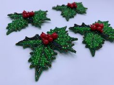 "Here is the green red brooch - Holly Leaf with berries. The Christmas pin looks amazing. Our floral beaded jewelry pin will be a great addition to your shawl, dress, costume or jacket. The leaf lapel pin will be a perfect birthday or Christmas gift for sister, daughter or friend and awesome bridesmaid hair clip. The botanical pin is in harmony with different kinds of clothing. Unusually and elegantly Chrismas brooch looks on the cardigan or sweater. The leaf brooch is invariably trend accent in Green Christmas Brooches For Gifts, Green Christmas Brooches As Gifts, Shawl Dress, Red Brooch, Bridesmaid Hair Clips, Christmas Gifts For Sister, Knitting Project Bag, Leaf Brooch, Botanical Jewelry