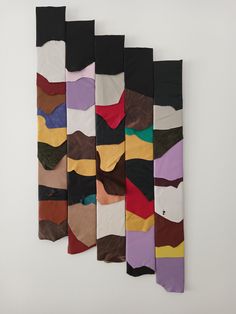 five pairs of colorful socks hanging on the wall