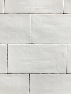 a white brick wall is shown in this image