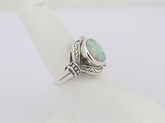 Vintage Sterling Silver Oval cut White Opal Carved Dome Ring ...Marked 925...Total of weights 3.9grams...Size 7...Measure of Face 15.3MM...It's in very good condition. Blue Opal Earrings, Silver Flower Ring, Topaz Engagement Ring, Engagement Ring Sizes, Sterling Silver Flowers, Domed Ring, Pinky Ring, Opal Earrings, Oval Cut