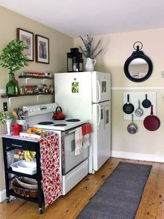 a kitchen with an oven, stove and pot rack