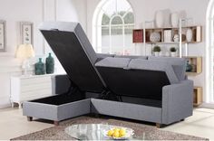 a gray couch with its open lid opened