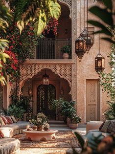 an outdoor patio with couches and potted plants