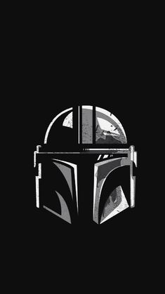 the boba fett helmet from star wars is shown in black and white on a dark background