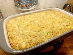 a casserole dish sitting on top of a wooden table